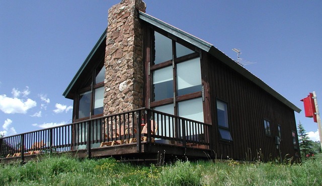 Rustic mountain home with stunning mountain views from the large deck!