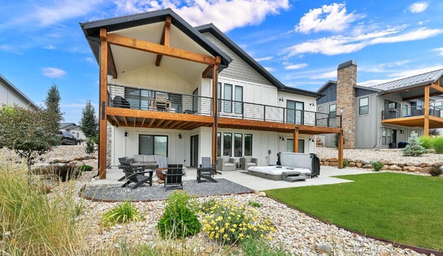 Stunner with Lake Mountain Views and Private Hot Tub