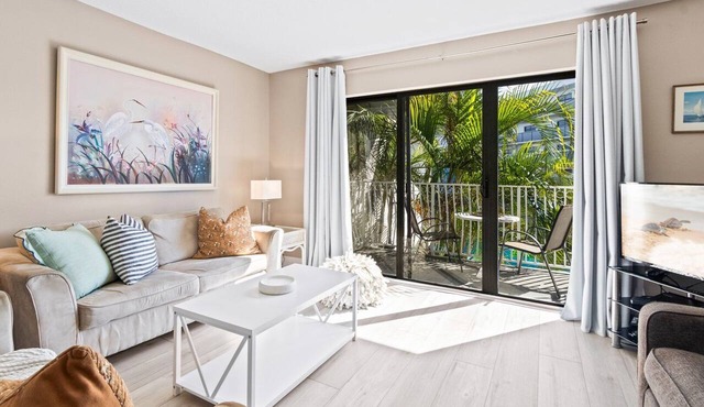 Sunny Condo w/Private Balcony, Heated Pool, and Steps to Beach Access & Pier! ☀️🏖️