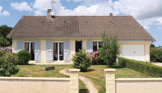 This large house is tastefully decorated and has a large living room with an open fireplace.